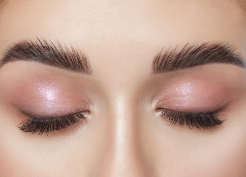 Photo of a woman's brow extensions full set