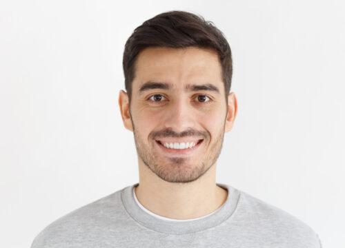 Photo of a smiling man after the Men's Deep Pore Cleansing Facial