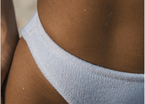 Lashiqué’s expert spray tan application for a seamless, natural glow that lasts, with customized solutions tailored to your skin tone.