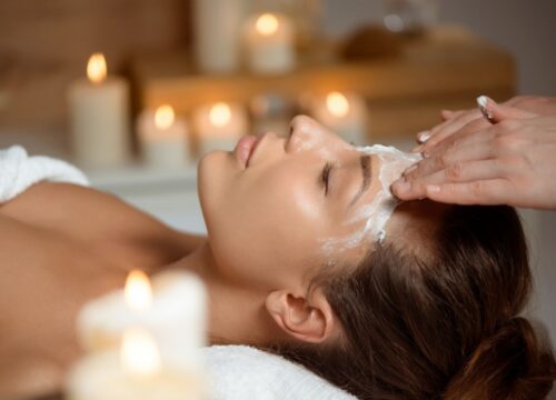 A serene client undergoing a professional enzyme facial.